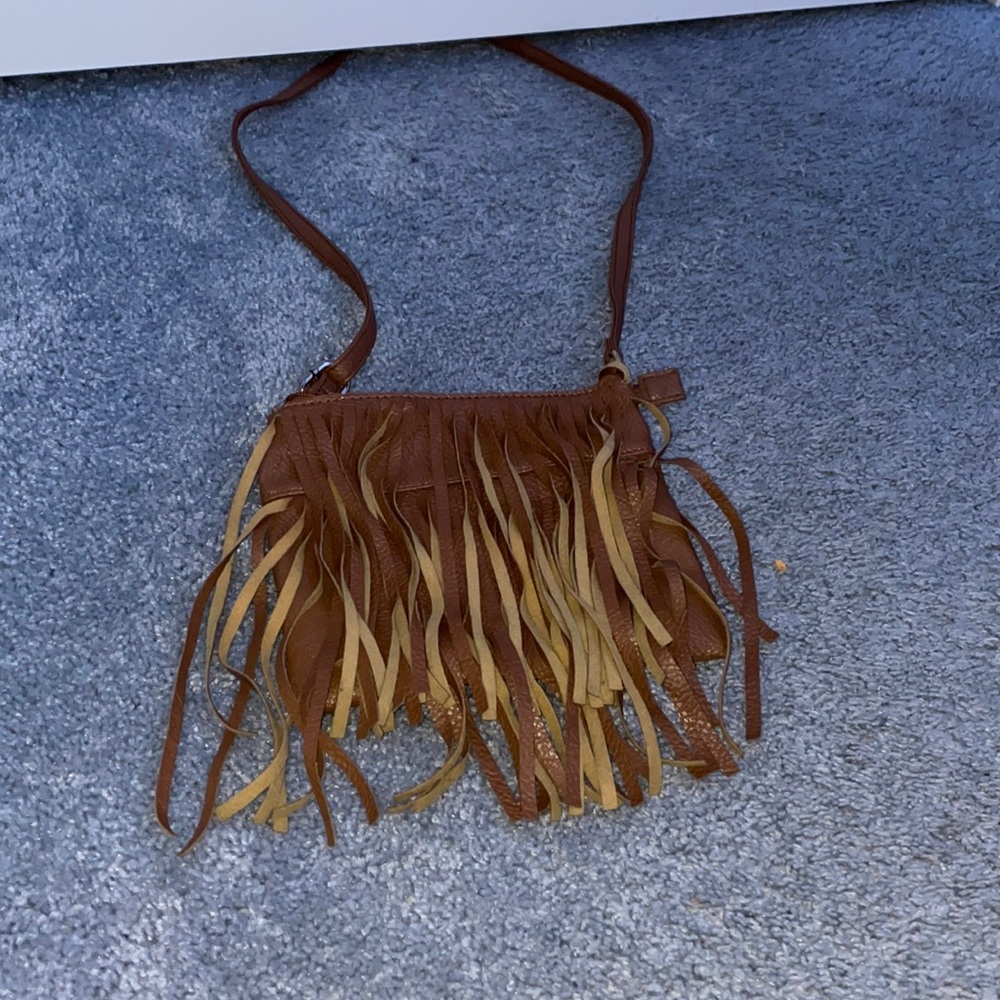 It’s a brown purse that’s cute for kids